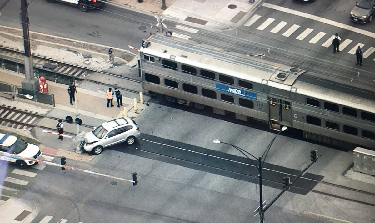 Metra Electric train slowly moving past the crash at 71st and Stony Island. 2 people injured. A 48-year-old male in serious condition and 52-year-Old female with minor injuries both transported to University of Chicago Hospital