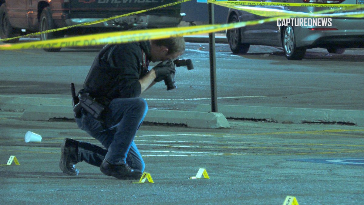 Lansing, IL: Police investigate a shooting at Hooters in the 17000 Block of Torrence Avenue late Thursday night. Crime scene tape and shell casings covered the parking lot.