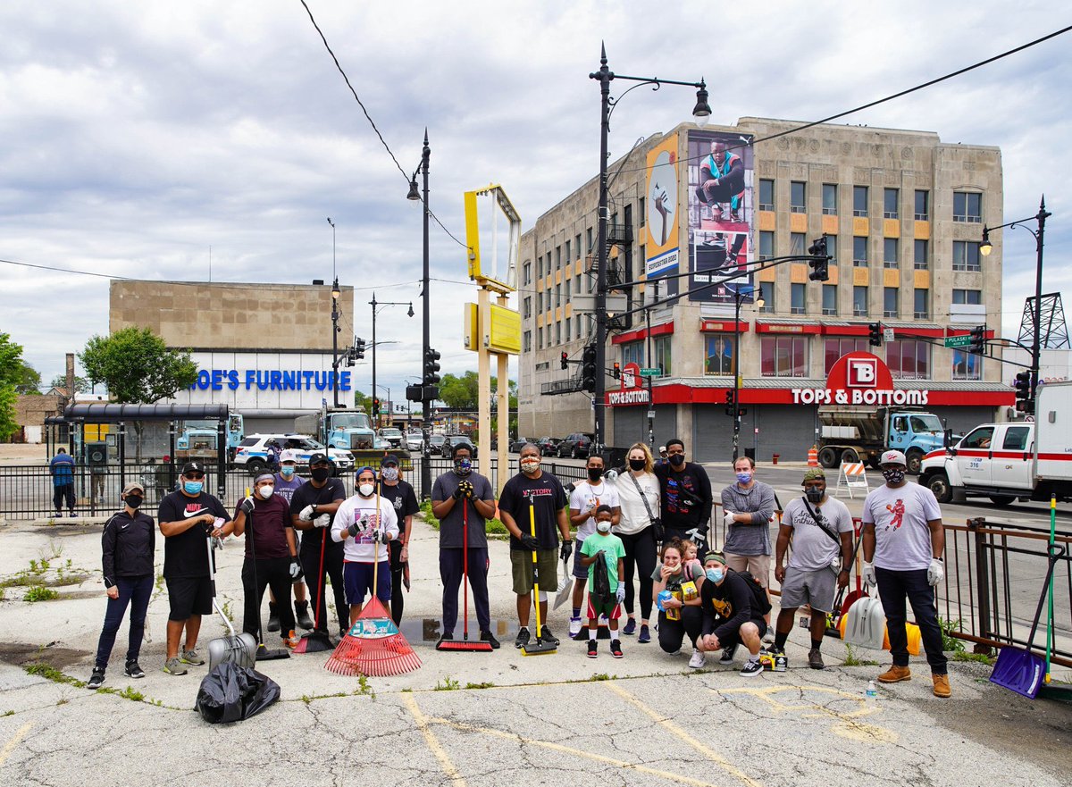 The Few People Out In Little Village Use Their Phones To Record The Crowd Moving Through 26th Street From An Apartment Two Young Girls Lifted Their Window And Used Their Phones To