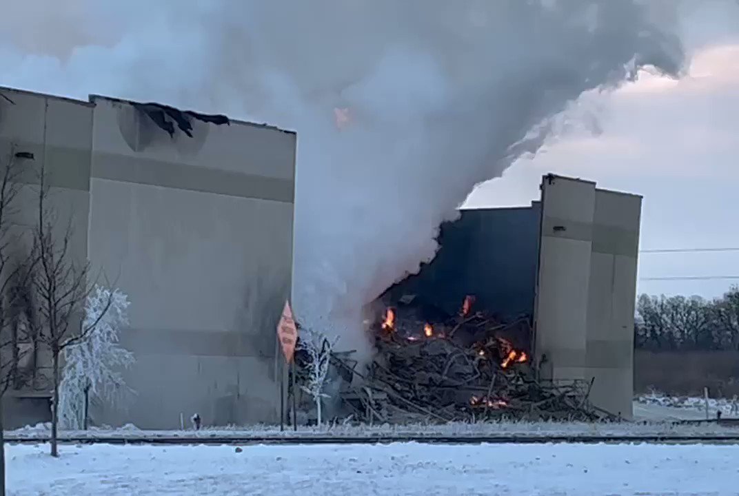 Firefighters are still battling a fire at a large industrial warehouse in Bartlett