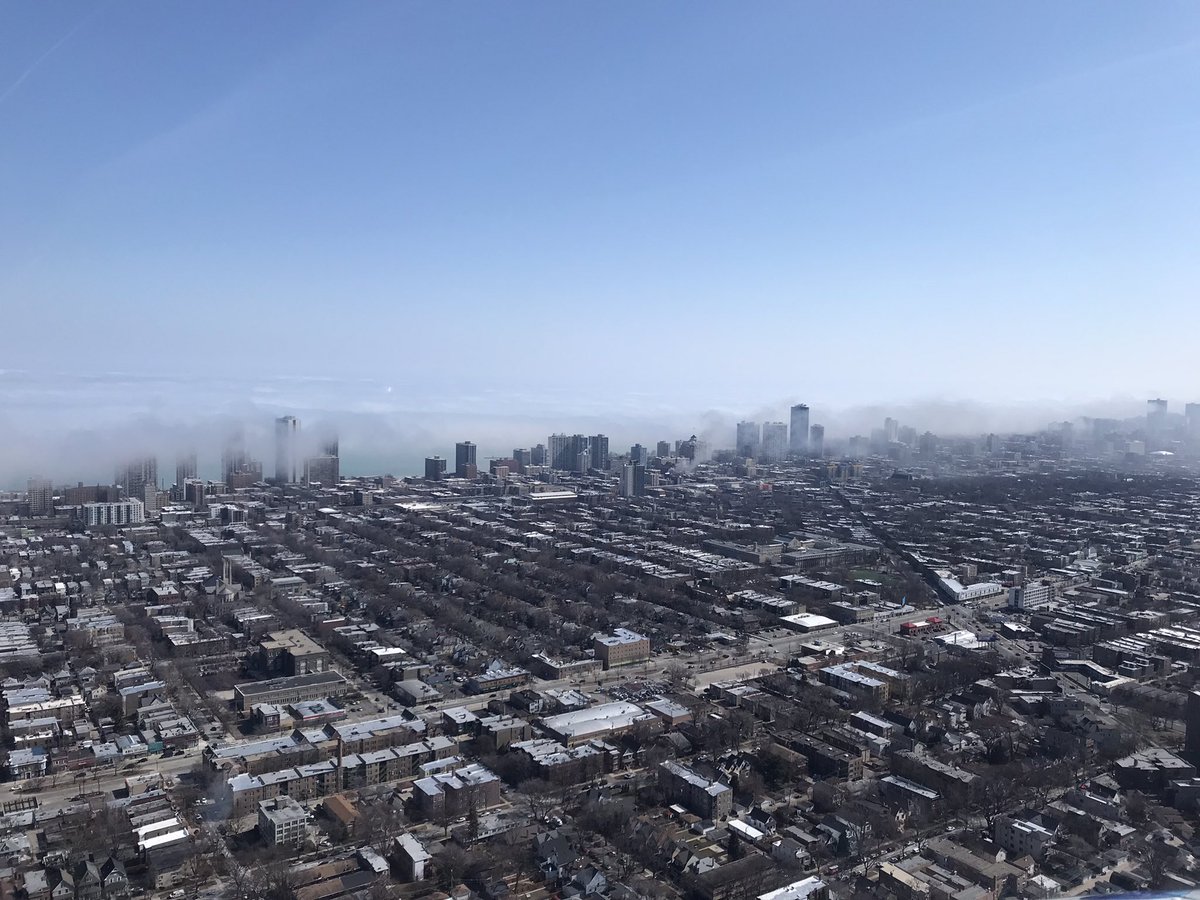 From a distance it's hard to differentiate the fire smoke from low lakefront cloud bank