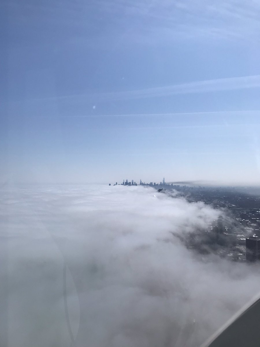 From a distance it's hard to differentiate the fire smoke from low lakefront cloud bank