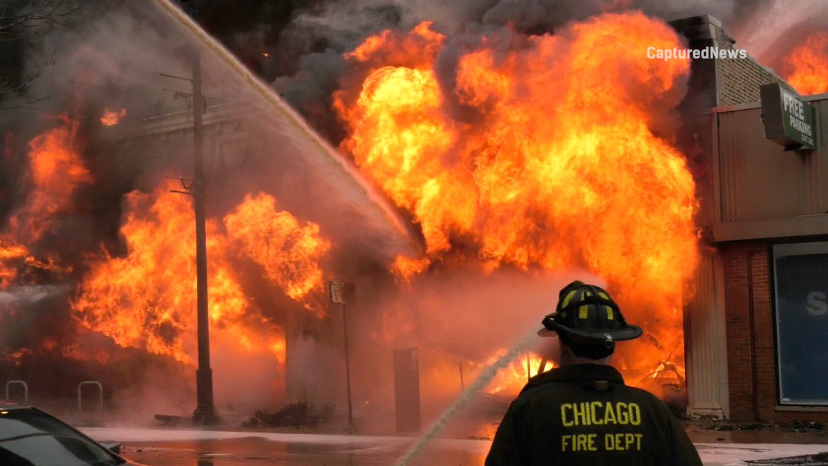 Firefighters continue to battle a 3-11 alarm fire in AlbanyPark. The building has collapsed.