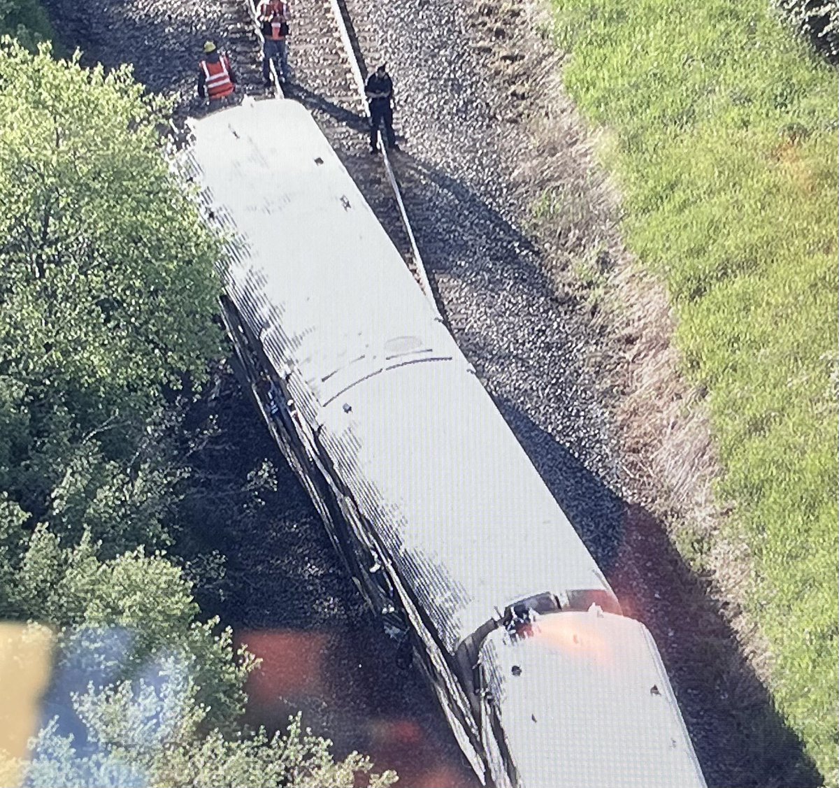 Milwaukee North Line train 2116 sits partly derailed after striking a 5 axle dump truck at a private crossing just south of Route 120 in Grayslake. No word yet on injuries to the truck driver or anyone aboard the train. s at