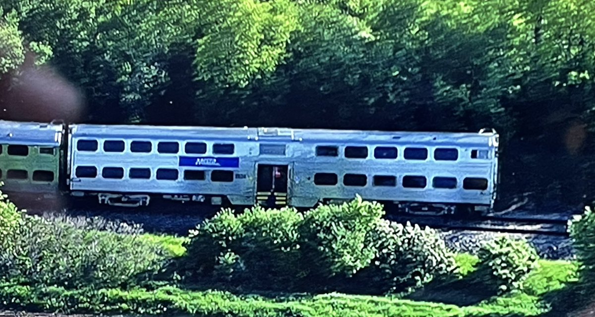 Milwaukee North Line train 2116 sits partly derailed after striking a 5 axle dump truck at a private crossing just south of Route 120 in Grayslake. No word yet on injuries to the truck driver or anyone aboard the train. s at