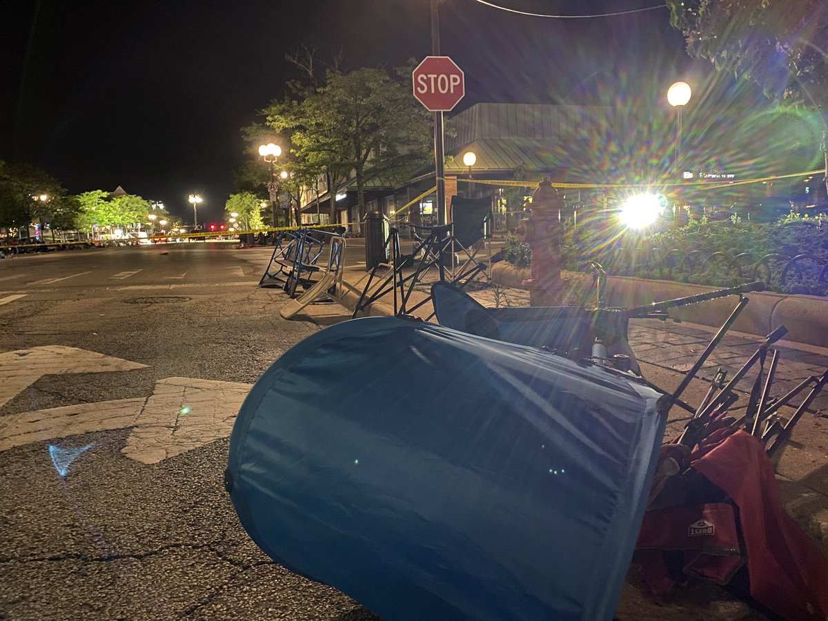 Quite an eerie scene here in Highland Park this morning.   Police still have the crime scene from yesterday's shooting taped off, and peoples belongings still line the parade route after storms rolled through overnight.   Suspect Bobby Crimo was taken into custody last night