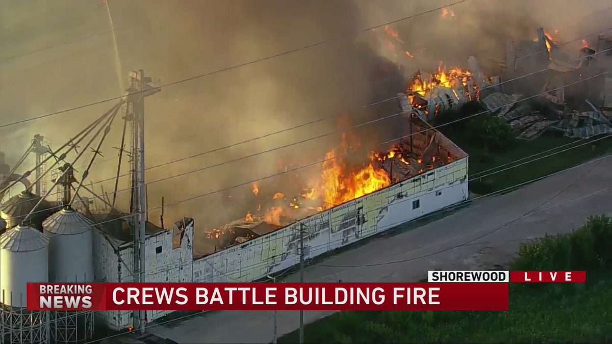 SHOREWOOD: Huge fire has Black Rd closed from River Rd to County Line Rd. Appears to be at a Landscaping supply store/farm.   Shorewood Police are asking people nearby to SHELTER IN PLACE due to the toxic fumes from burning fertilizer