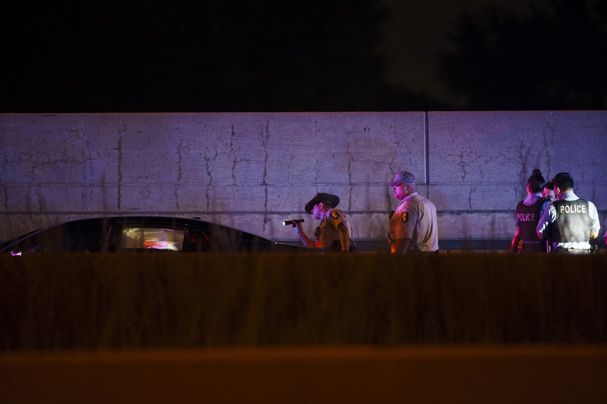 Officers work the scene of a shooting on the inbound lanes of the Stevenson Expressway near the Dan Ryan Expressway entrance ramp Thursday in Chicago