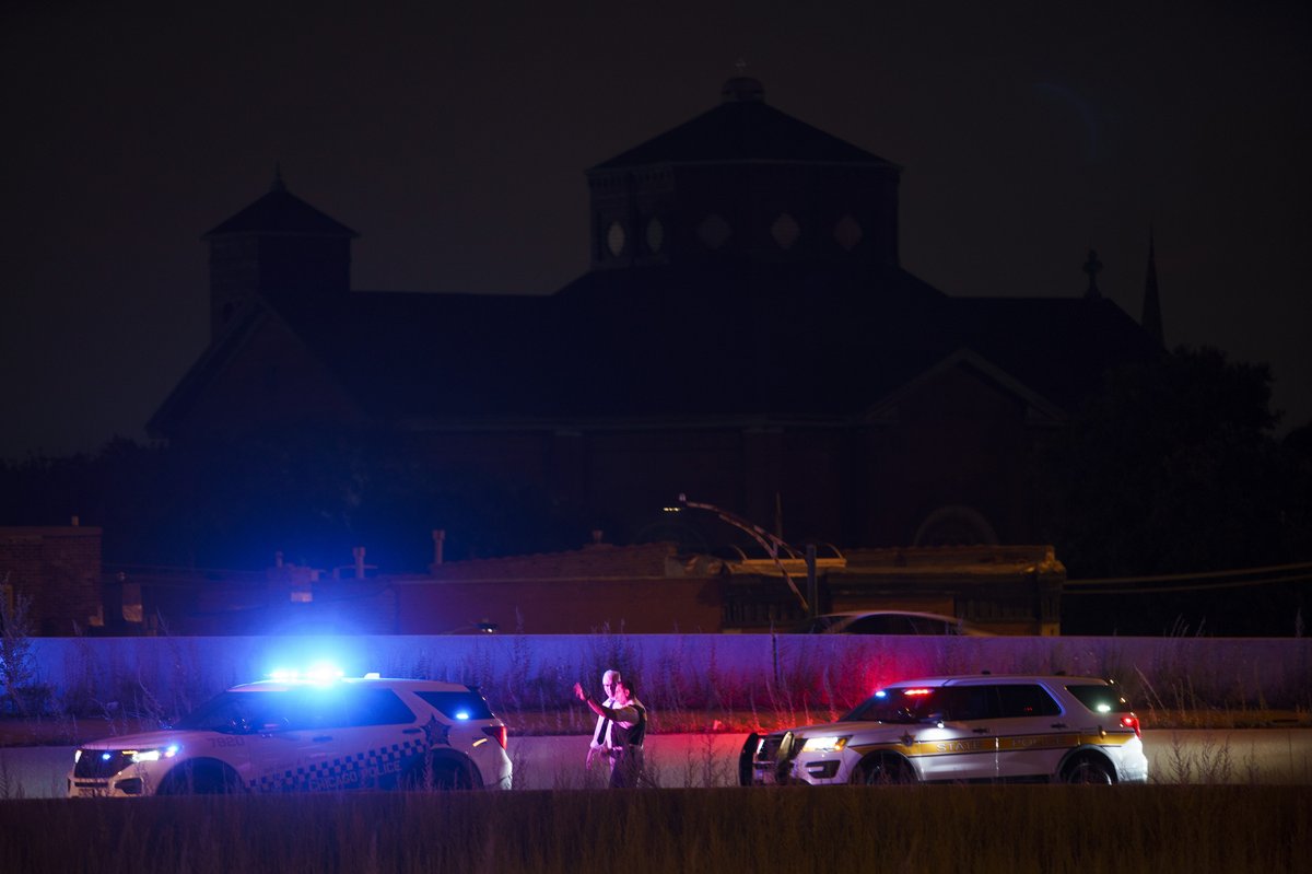 Officers work the scene of a shooting on the inbound lanes of the Stevenson Expressway near the Dan Ryan Expressway entrance ramp Thursday in Chicago