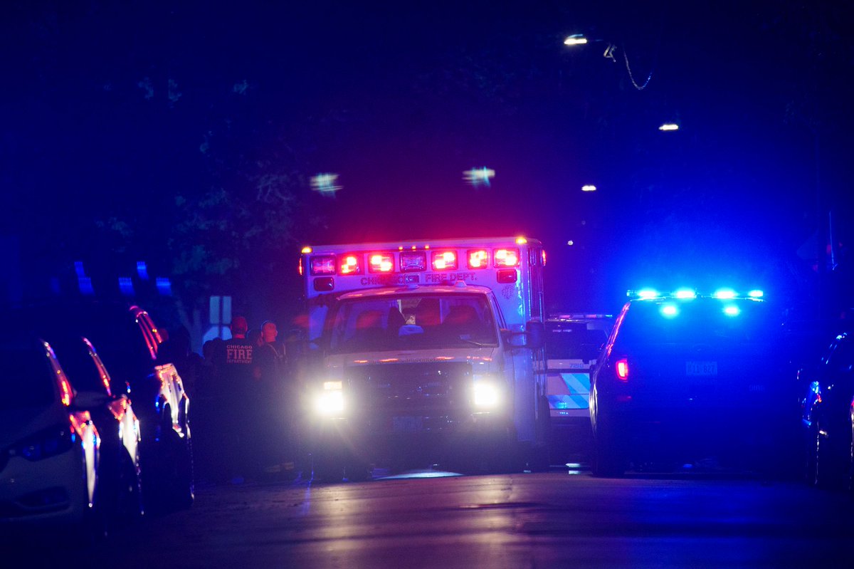 Members of the Chicago Police and Fire department work the scene where an officer shot a person Thursday shortly before midnight near the 5300 block of South May Street Friday in Chicago. According to police spokesman Tom Ahern, a gun was recovered from the scene.