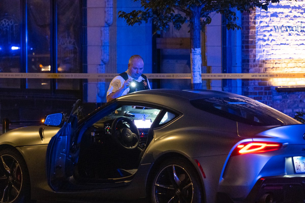 Chicago police work the scene where a 38-year-old man was shot while driving in a silver Toyota Supra in the 400 block of North La Salle Street in the River North neighborhood, Saturday