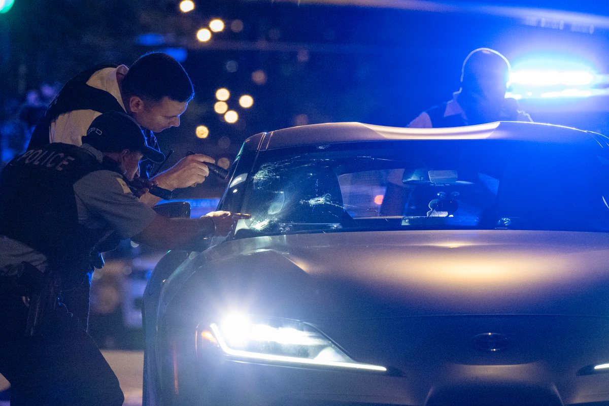 Chicago police work the scene where a 38-year-old man was shot while driving in a silver Toyota Supra in the 400 block of North La Salle Street in the River North neighborhood, Saturday