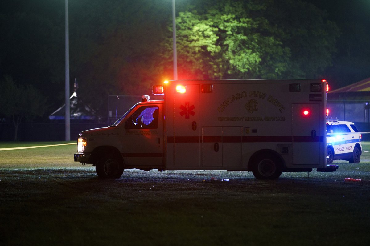 Officers work the scene where multiple people were shot in Washington Park Tuesday evening in Chicago. According to CPD spokesman Tom Ahern there are multiple victims but a total number has not yet been given