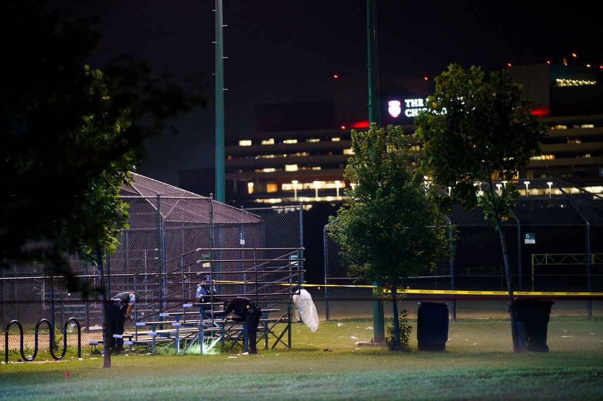 Officers work the scene where multiple people were shot in Washington Park Tuesday evening in Chicago. According to CPD spokesman Tom Ahern there are multiple victims but a total number has not yet been given