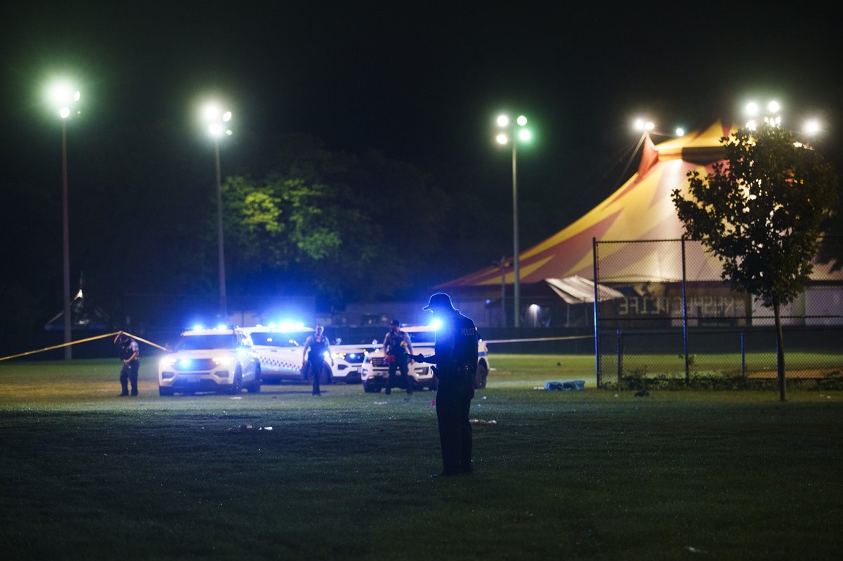 Officers work the scene where multiple people were shot in Washington Park Tuesday evening in Chicago. According to CPD spokesman Tom Ahern there are multiple victims but a total number has not yet been given