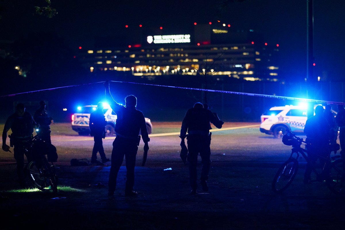 Officers work the scene where multiple people were shot in Washington Park Tuesday evening in Chicago. According to CPD spokesman Tom Ahern there are multiple victims but a total number has not yet been given