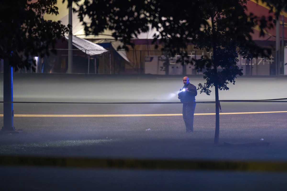 Chicago police work the scene where multiple people (possible as many as 13) were shot near a baseball field in Washington Park, Tuesday, Sept. 13, 2022.  