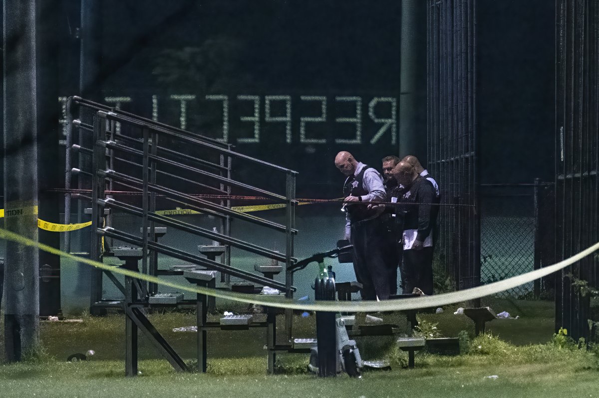 Chicago police work the scene where multiple people (possible as many as 13) were shot near a baseball field in Washington Park, Tuesday, Sept. 13, 2022.  