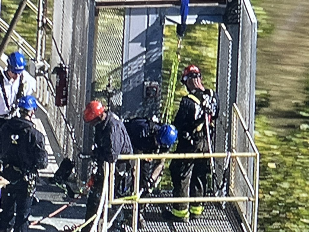 Chicago Fire Department Squad Co. members on scene at the south end of Calumet Harbor off 130th. 2 men have become stuck in an external elevator, 150' up a 200' dry cement storage silo. The 2 are fine and the CFD is here to make sure they stay ok. More at