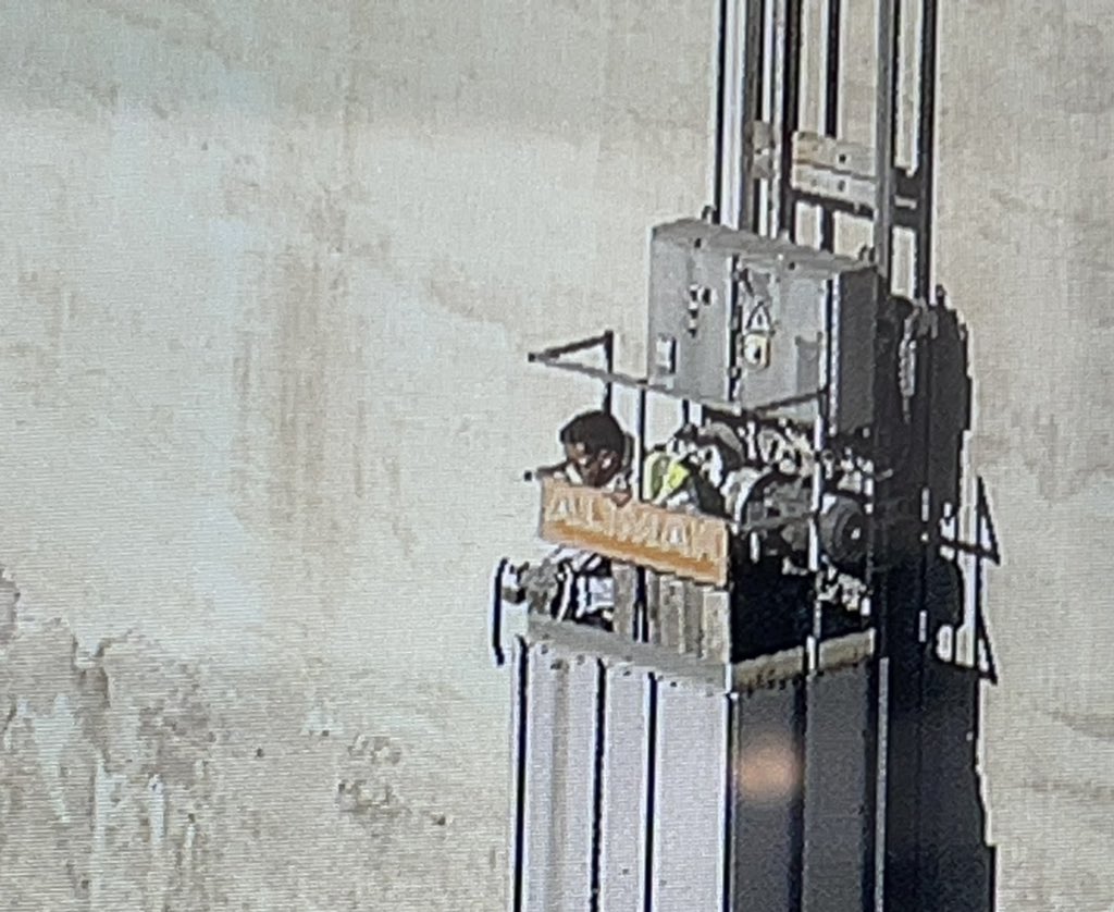 Chicago Fire Department Squad Co. members on scene at the south end of Calumet Harbor off 130th. 2 men have become stuck in an external elevator, 150' up a 200' dry cement storage silo. The 2 are fine and the CFD is here to make sure they stay ok. More at