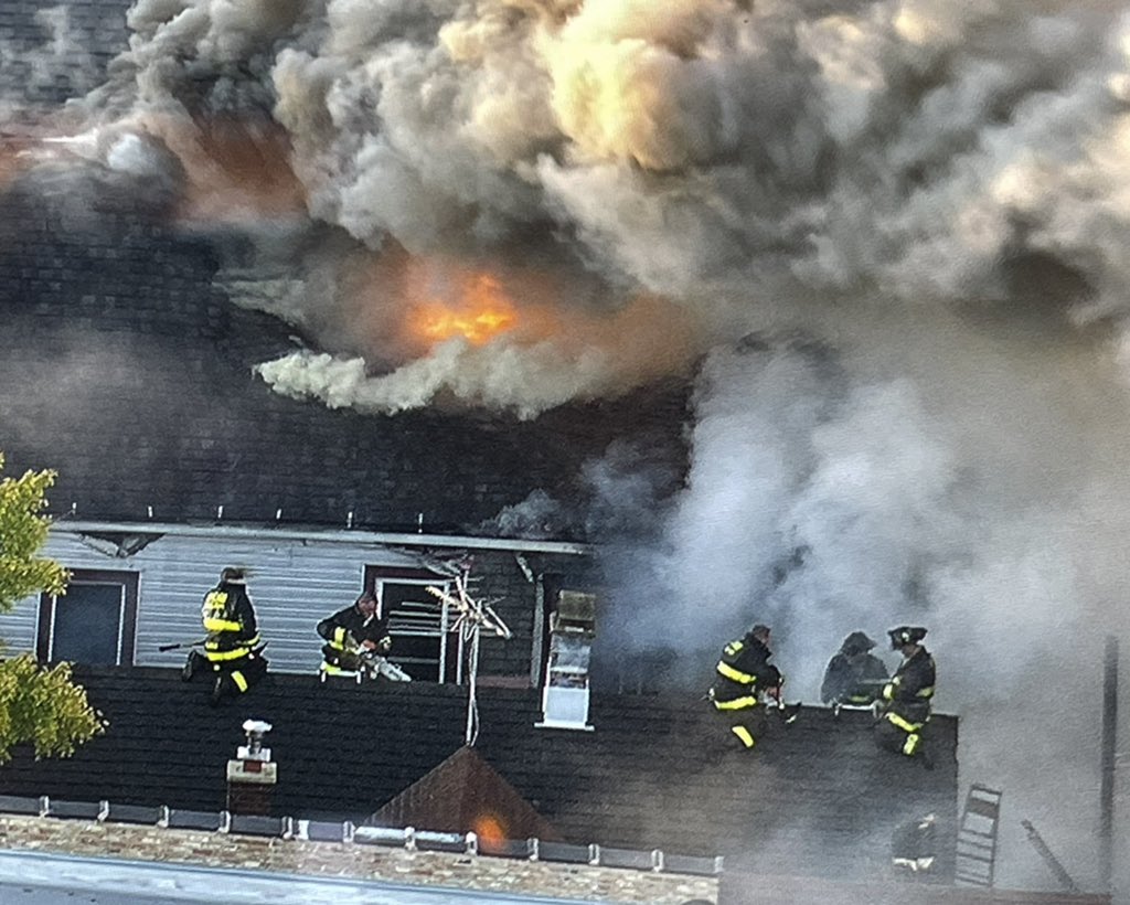 Chicago firefighters gaining point of vantage using fire damaged exposure buildings to get water into the seat of heavy fire in the 2400 block of N. Washtenaw. Operations are fully defensive, as the original fire building burns.  