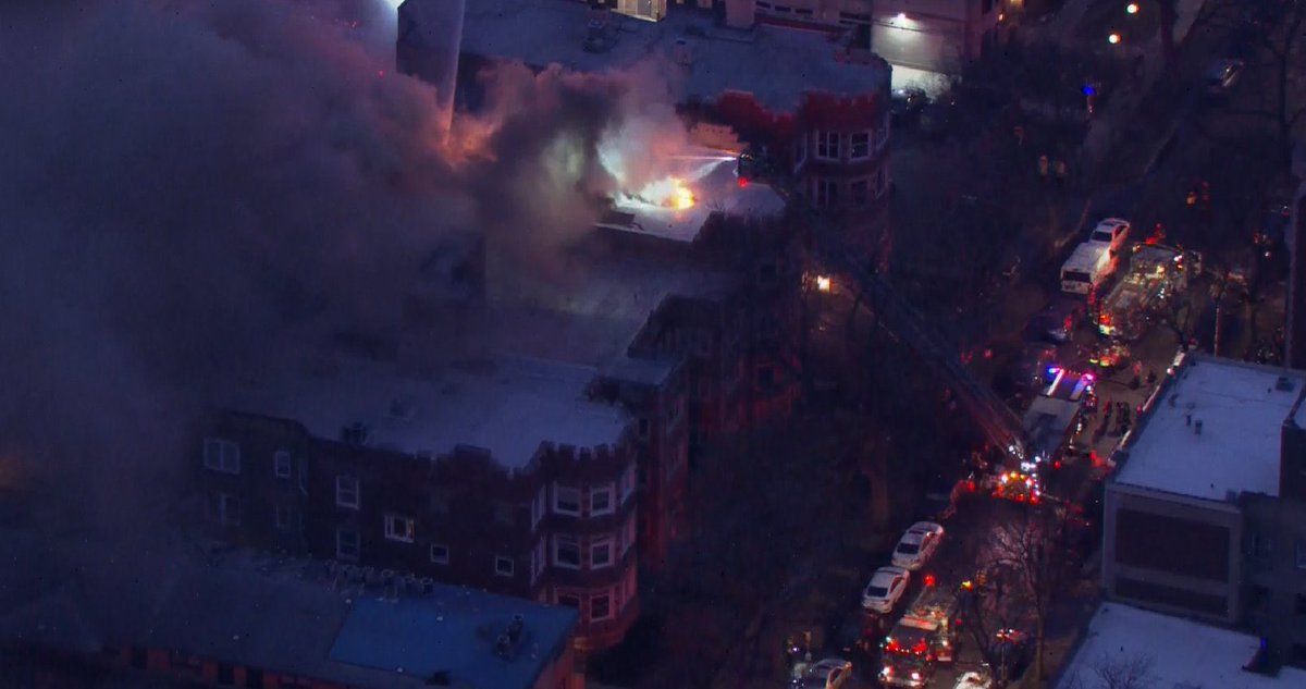 Huge response to a fire in Hyde Park this morning in the 5100 block of S Kenwood  One person hospitalized in critical condition. Flames and heavy smoke pouring from the top of the apartment building  Hyde Park Blvd closed Dorchester-Kimbark; Kenwood closed south of Hyde Park Blvd