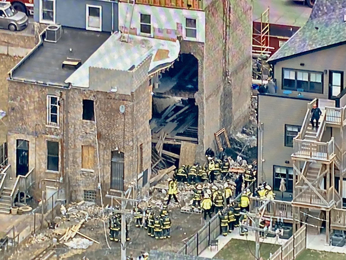 Bronzeville - Fire crews working to rescue someone trapped in the debris after a building collapsed on Oakwood Blvd near Cottage Grove. They just transported the person into a waiting ambulance