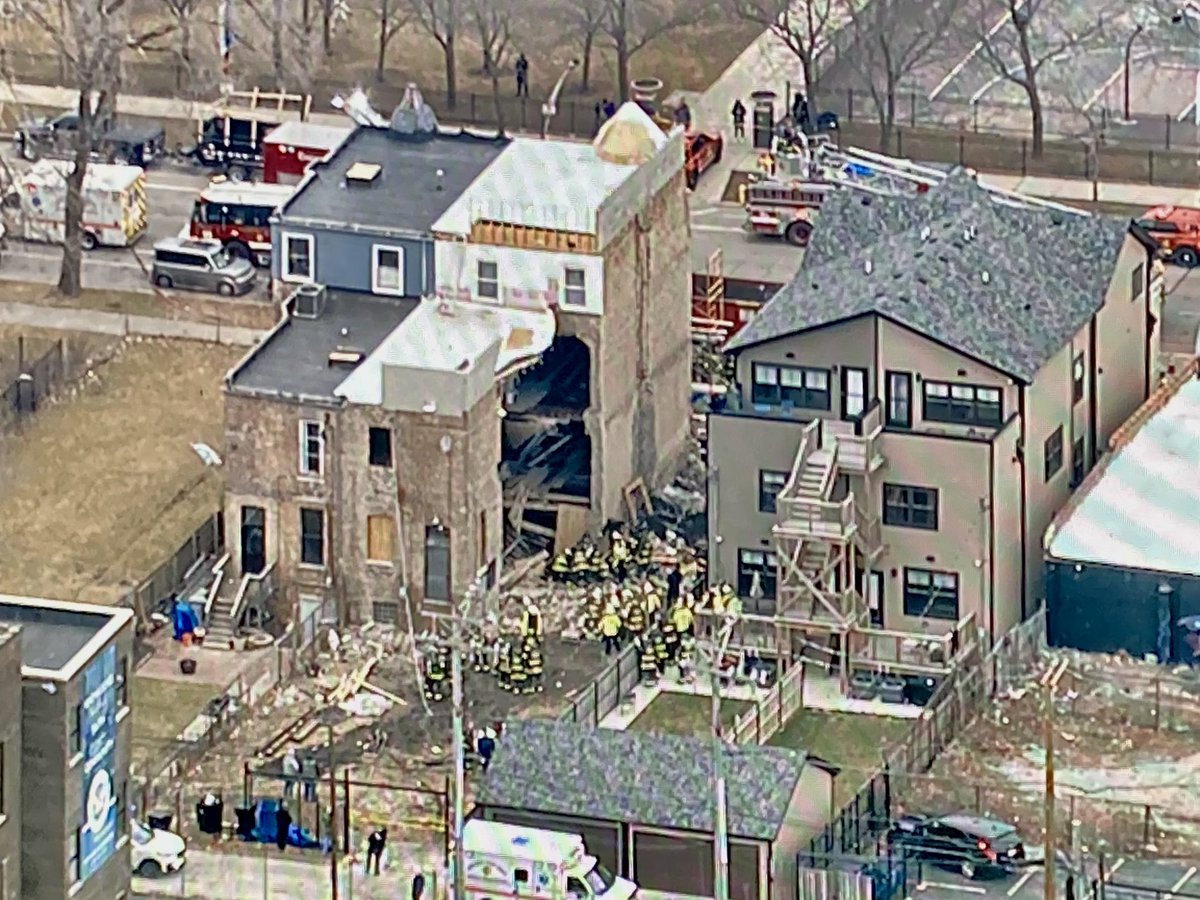 Bronzeville - Fire crews working to rescue someone trapped in the debris after a building collapsed on Oakwood Blvd near Cottage Grove. They just transported the person into a waiting ambulance