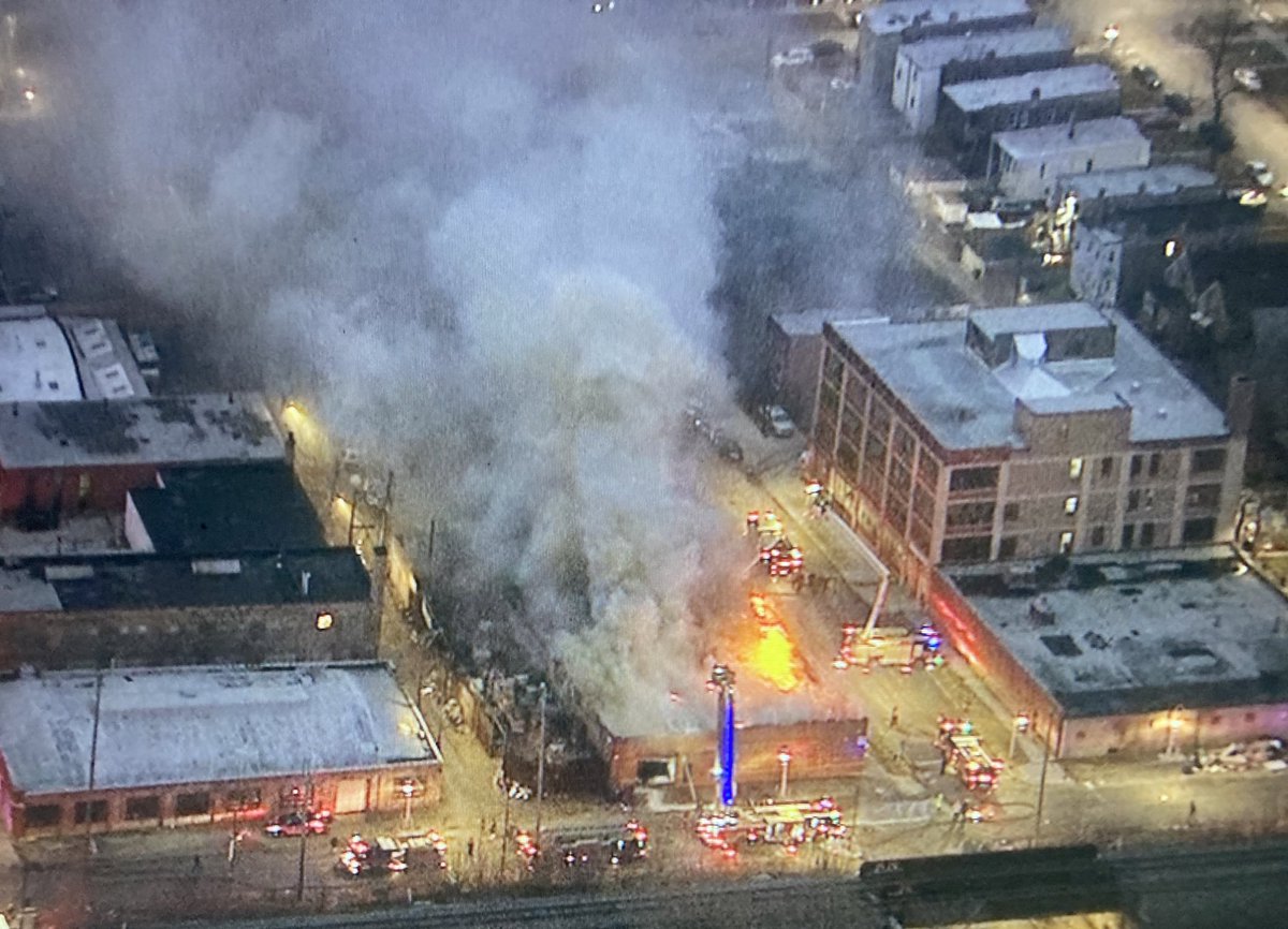 WestGarfieldPark - 2 Alarm fire continues to rage through the entire roof & building at Kenton &amp; Fulton. No injuries reported. Equipment blocks Lake St, Kenton, &amp; Fulton in the area