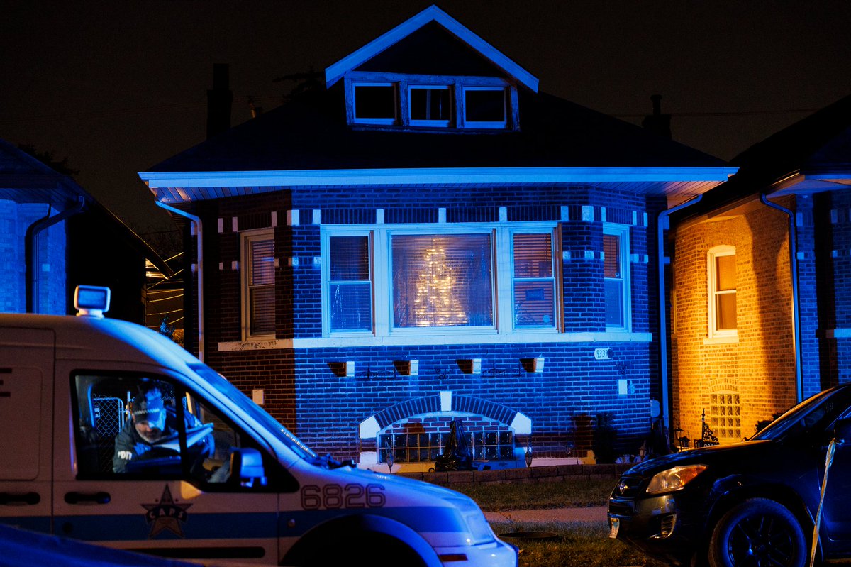 Officers work the scene where four people, including three children, were shot on the 9300 block of South Racine Avenue Monday evening in Chicago. According to police two 15-year-old boys, a 16-year-old boy, and a 21-year-old man were wounded in the shooting