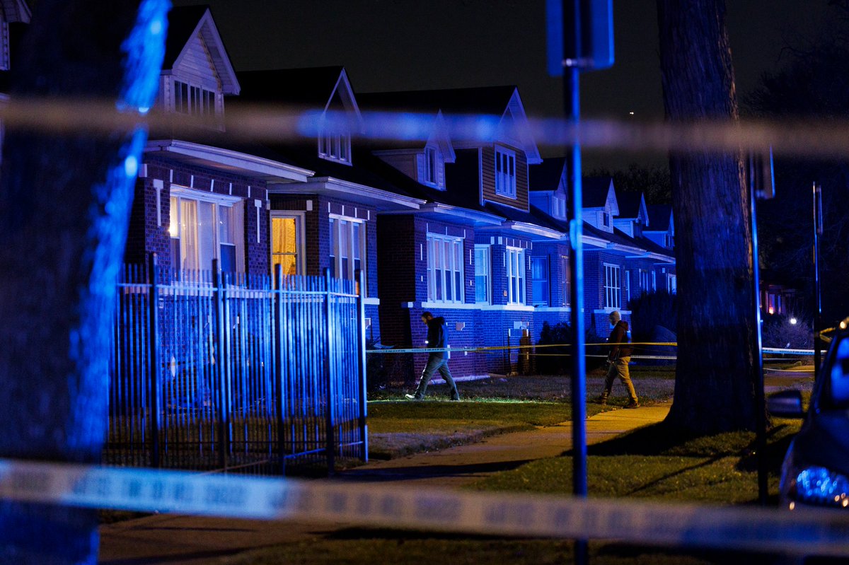 Officers work the scene where four people, including three children, were shot on the 9300 block of South Racine Avenue Monday evening in Chicago. According to police two 15-year-old boys, a 16-year-old boy, and a 21-year-old man were wounded in the shooting