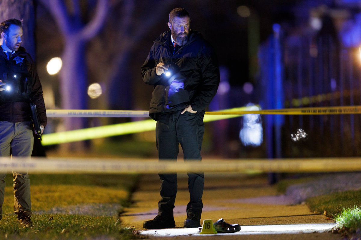 Officers work the scene where four people, including three children, were shot on the 9300 block of South Racine Avenue Monday evening in Chicago. According to police two 15-year-old boys, a 16-year-old boy, and a 21-year-old man were wounded in the shooting