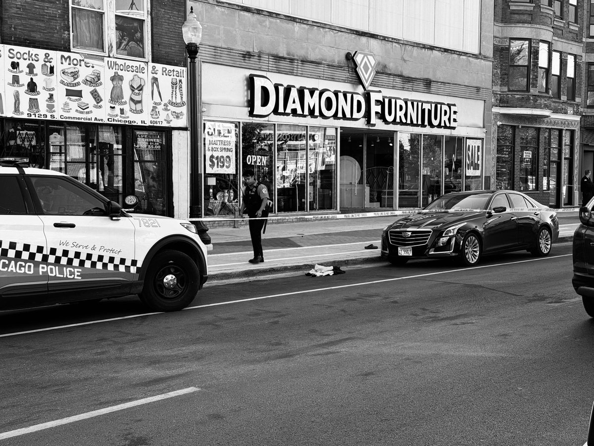 Male (32) shot in the back, 9129 S Commercial Chicago   the crime scene consists of 4 shell casings, blood, a bullet hole to the window of the furniture store, and the victim's shoes and jacket