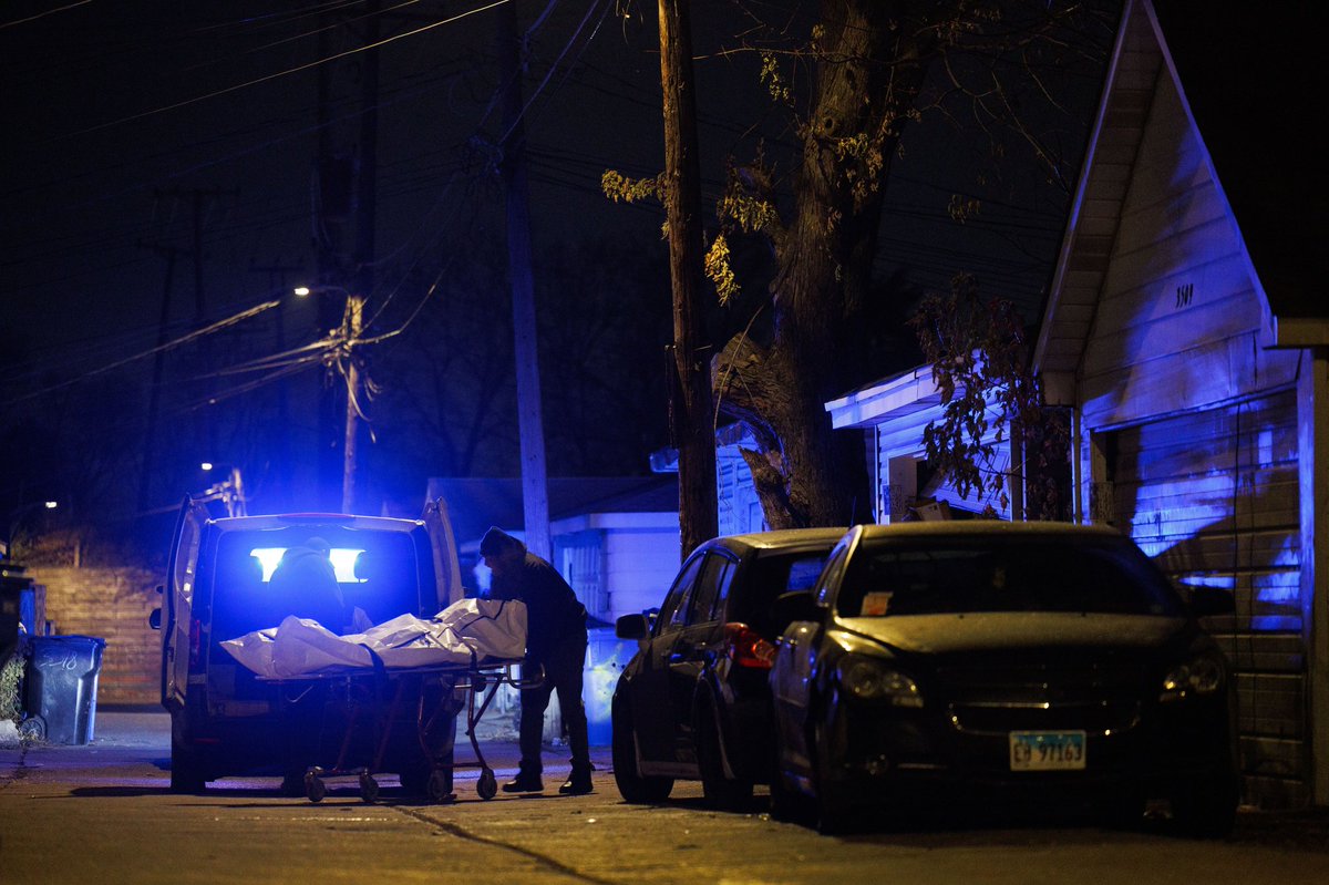 A body removal service transports a person who was fatally shot at the scene where eight people were shot, three fatally, near the 3500 block of West 59th Street Monday in Chicago