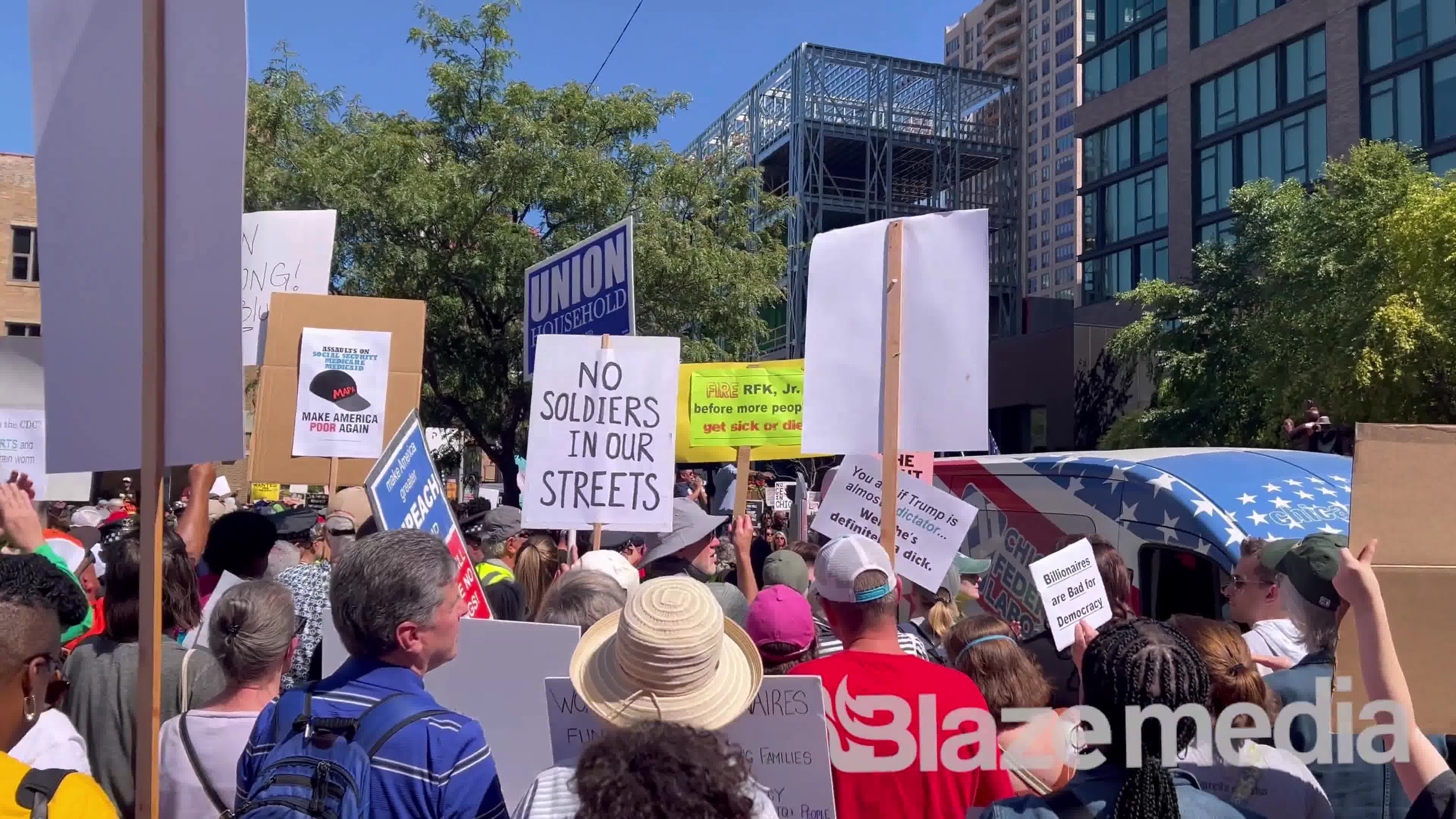 Chicago mayor Brandon Johnson holds rally to protest Trump’s safety measures as dozens were shot this weekend