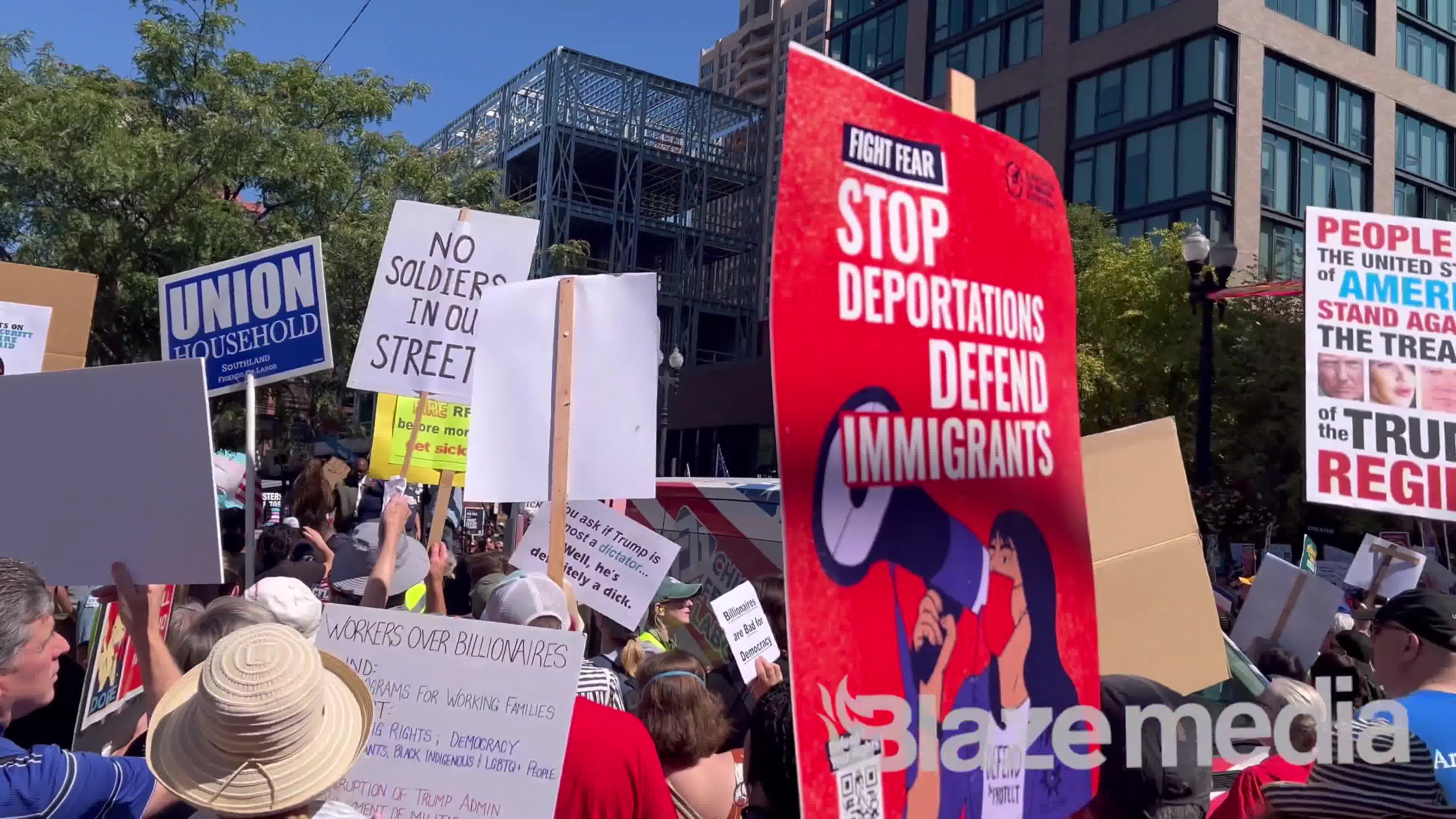 Chicago mayor Brandon Johnson holds rally to protest Trump’s safety measures as dozens were shot this weekend