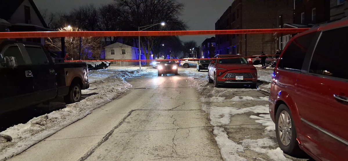 Car looks like it was involved in the shooting over here on 1520 East 74th Street . has been running since we've been down there it's almost an hour now . a 25-year-old was shot in the head and chest taken to UC hospital in grave condition